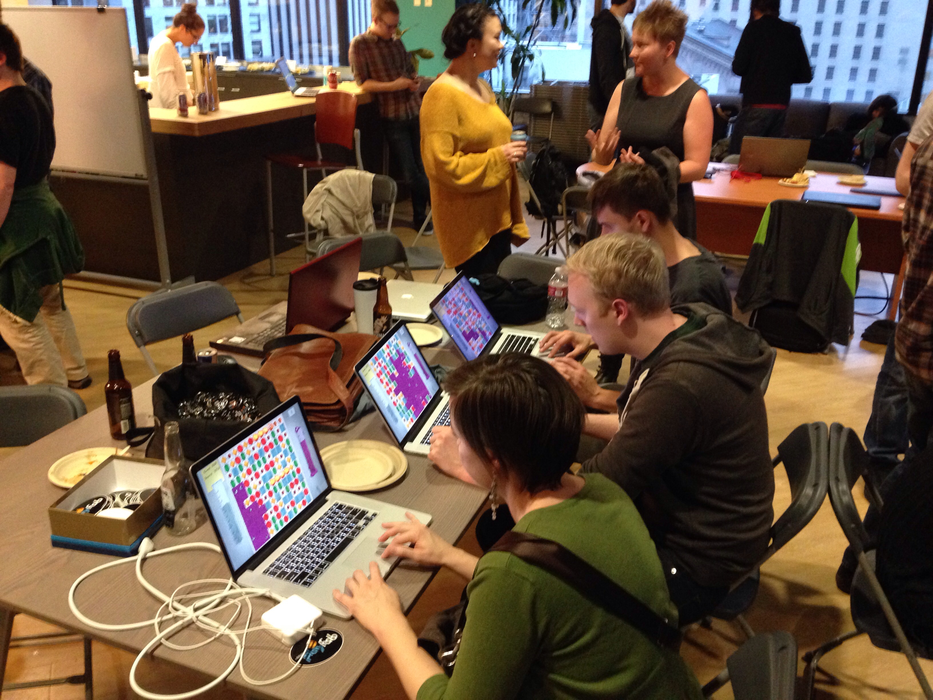 Jam attendees checking out our game after the competition